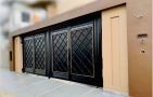 Main Gate with tailor made work using rod iron, SS steel and Gold powder coat design by Stylehome.